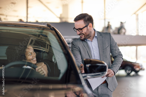 Businessman holding instructions and documents, the woman sittin