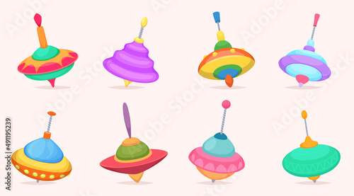 Top toys. Fun whirling distractions to children spinning rotation tops funny games exact vector cartoon illustrations set