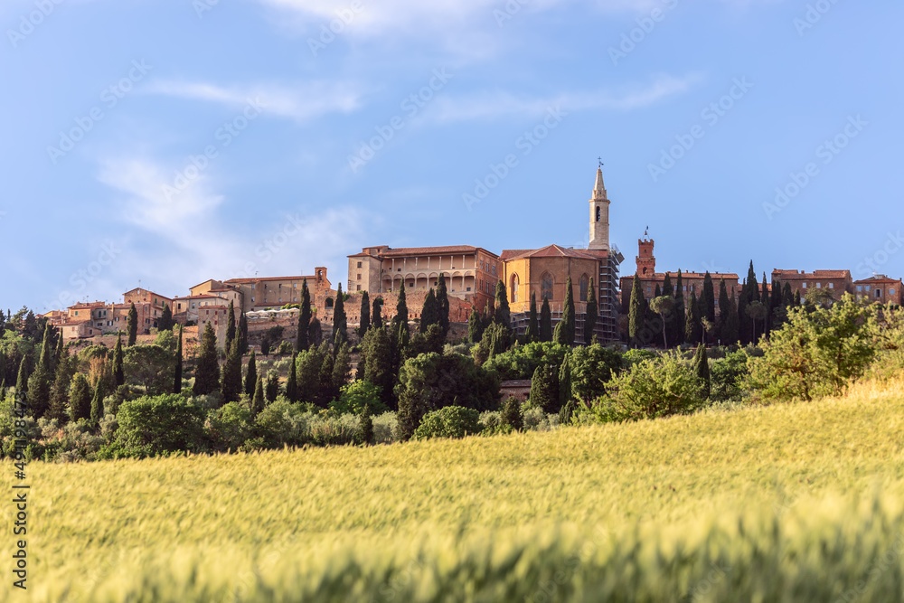 Ancient Pienza town appears among the lush vegetation of Tuscany Ancient Pienza town appears among the lush vegetation of Tuscany