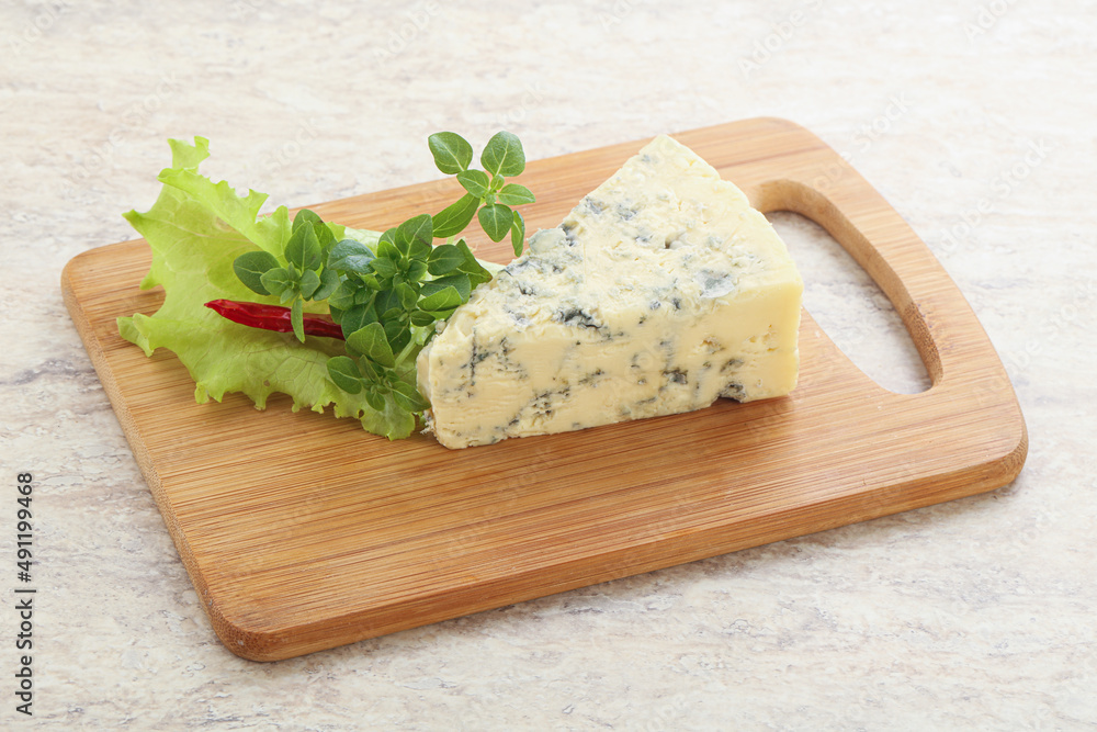 Blue cheese piece over board