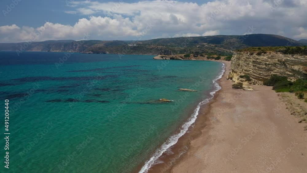 Aerial drone video of beautiful Mediterranean paradise bay in tropical exotic island with emerald crystal clear sea