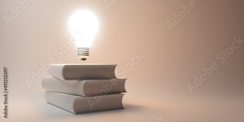 Glowing light bulb floating above stack of white books over white background, education, intelligence or idea concept