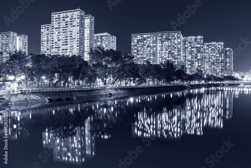 High rise residential building of public estate in Hong Kong city at night © leeyiutung