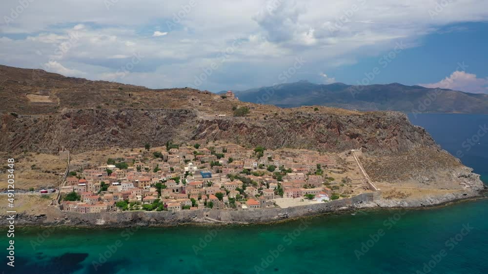 Aerial drone video of beautiful castle and medieval old city of Monemvasia in the heart of Lakonia with beautiful clouds and deep blue sky, Peloponnese, Greece Aerial drone video of beautiful castle and medieval old city of Monemvasia in the heart of Lakonia with beautiful clouds and deep blue sky, Peloponnese, Greece