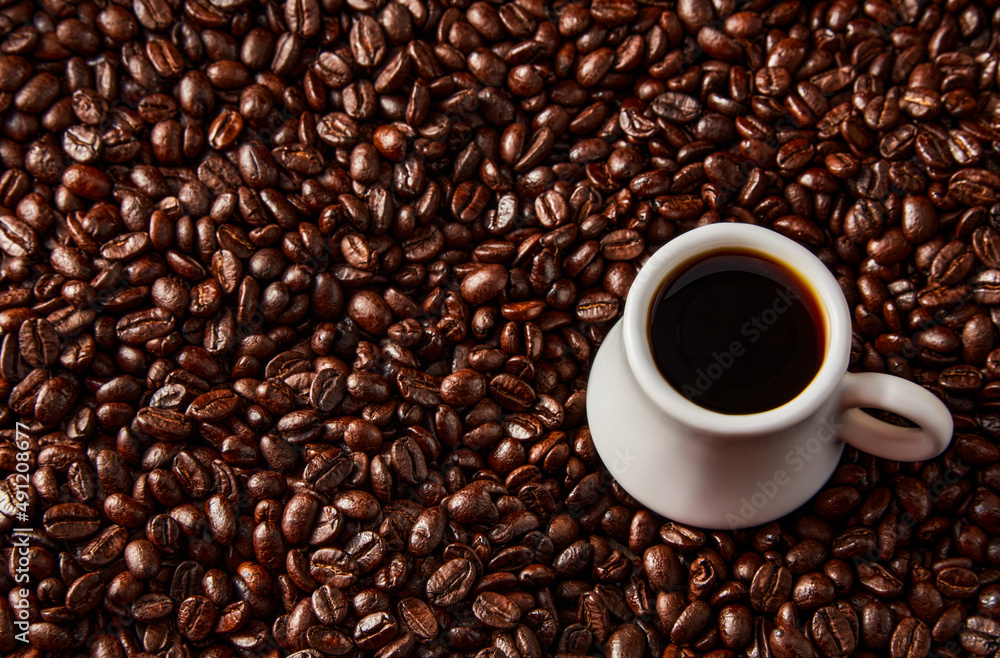 Fototapeta premium White cup with coffee beans...