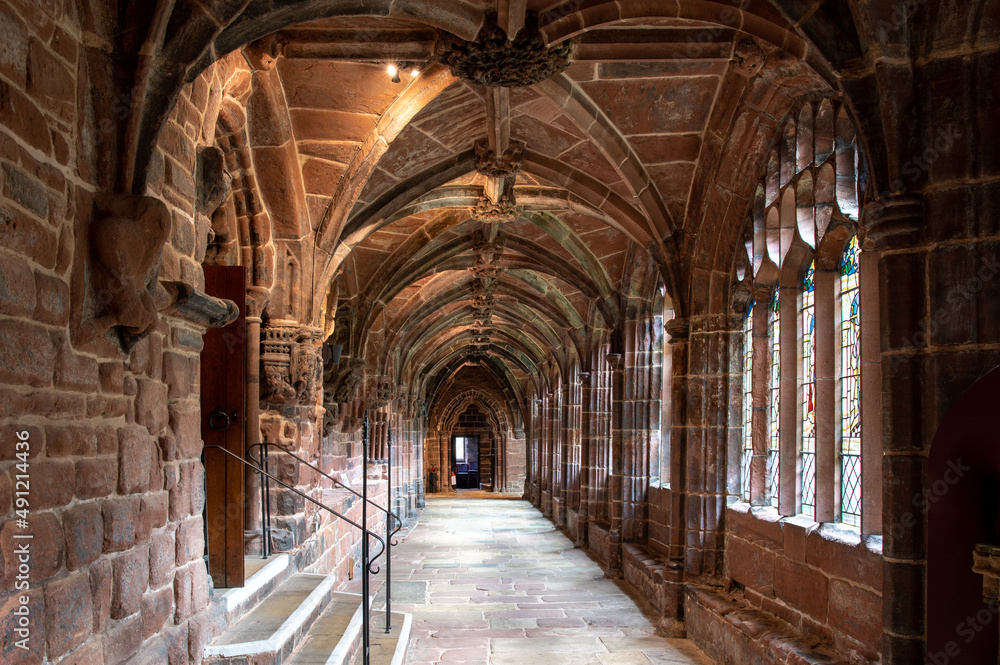 Stone walkway with ornate arched ceiling inside a cathedral