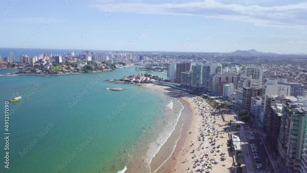 Sliding aerial shot of city canter and Praia do Morro beach in Guarapari, Espirito Santo, Brazil Sliding aerial shot of city canter and Praia do Morro beach in Guarapari, Espirito Santo, Brazil