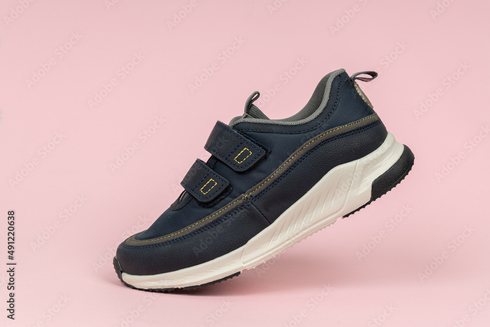Running sports shoe on pink background. Running shoe, sneaker or trainer. Athletic shoe. fitness, sport, training concept. Running sports shoe on pink background. Running shoe, sneaker or trainer. Athletic shoe. fitness, sport, training concept.