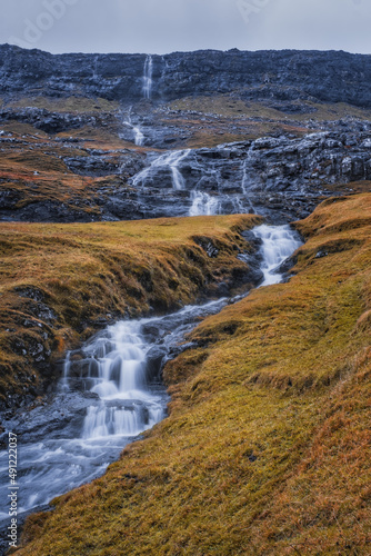 Europe, Faroe Islands. View of the village of Saksun and waterfalls on the island of Streymoy. November 2021