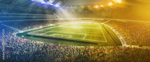 Night sport arena. Image of stadium and neoned colorful flashlights background. Concept of sport, competition, winning, action and motion.