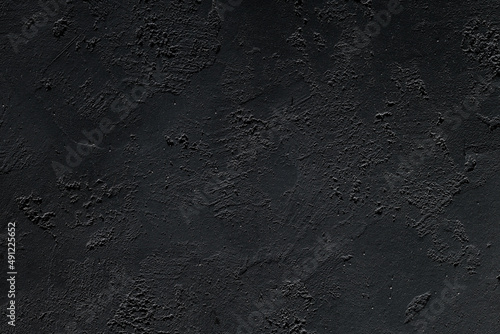 Dark grunge textured concrete background. Black backgrounds.