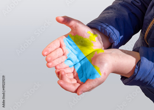 Children hands with Ukraine map