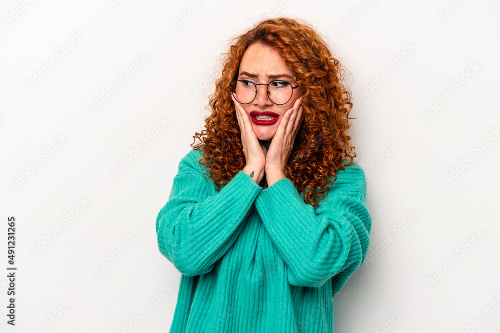 Young ginger caucasian woman isolated on white background scared and afraid. Young ginger caucasian woman isolated on white background scared and afraid.
