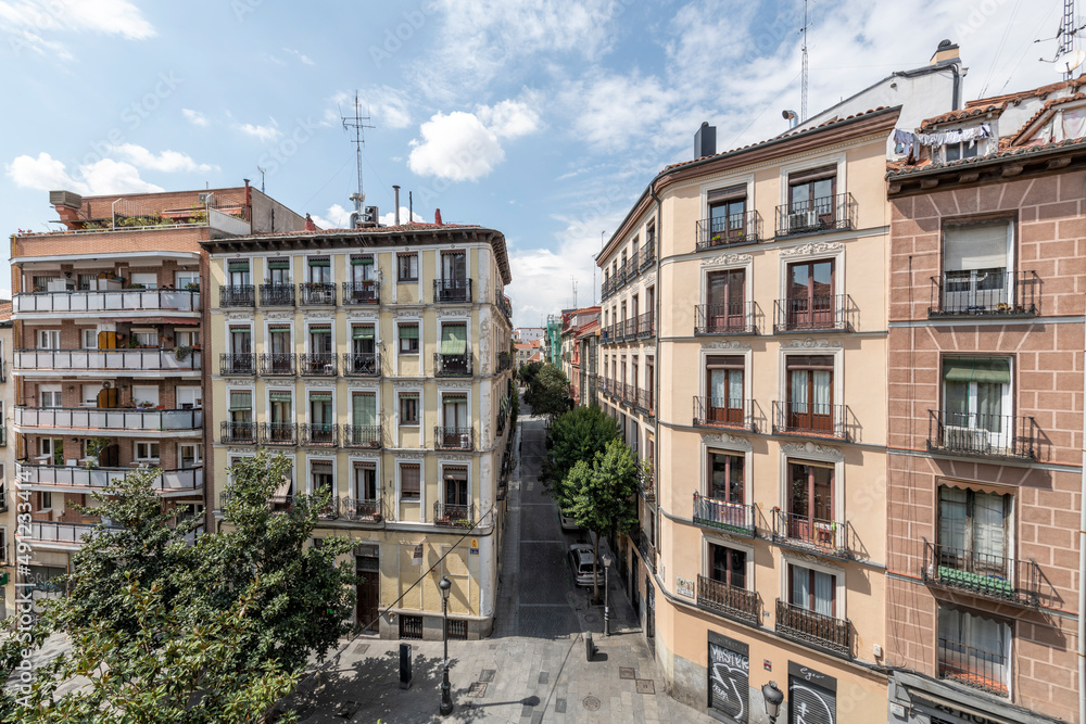 facades of vintage buildings in the lavapiés neighborhood in Madrid, Spain