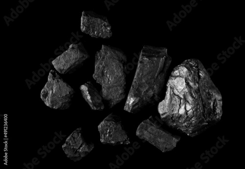 Pile black coal isolated on black, clipping path and top view