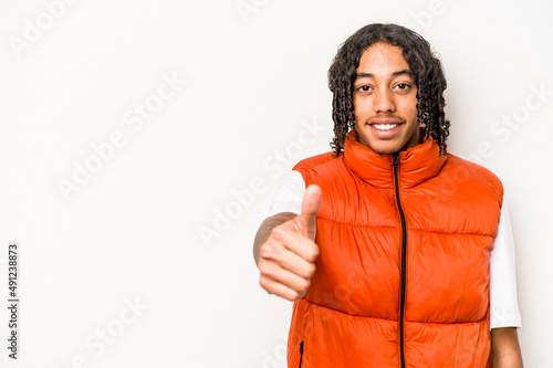 Young African American man isolated on white background smiling and raising thumb up