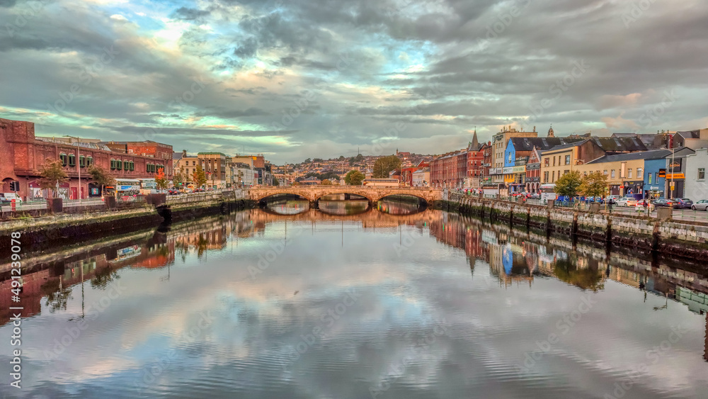 Morning view in Cork City Ireland business and classic buildings with reflection on the river