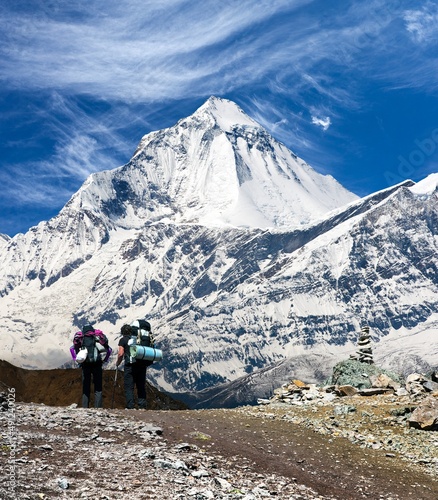 mount Dhaulagiri with two tourists himalaya mountain