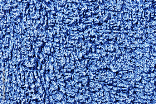 Blue towel texture. Macro fiber pattern. Soft cotton textile material background. Absorbent fluffy cloth.