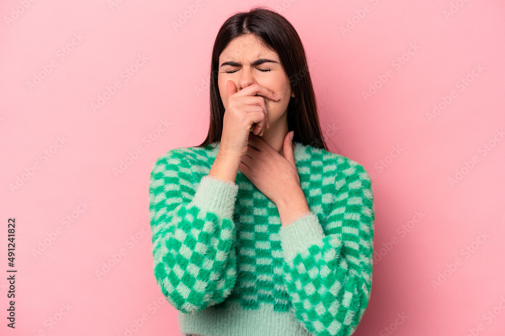 Young caucasian woman isolated on pink background suffers pain in throat due a virus or infection. Young caucasian woman isolated on pink background suffers pain in throat due a virus or infection.