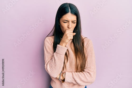 Young hispanic woman wearing casual clothes feeling unwell and coughing as symptom for cold or bronchitis. health care concept.