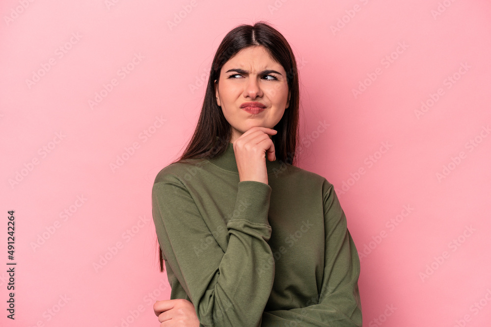 Young caucasian woman isolated on pink background suffers pain in throat due a virus or infection. Young caucasian woman isolated on pink background suffers pain in throat due a virus or infection.