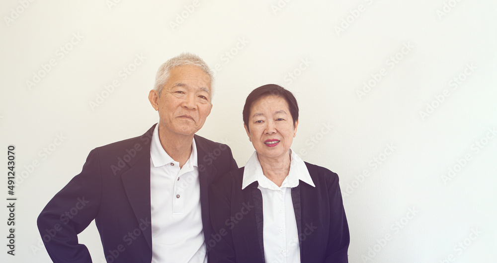 Asian senior elderly couple happy business owner hugging each other smiling Asian senior elderly couple happy business owner hugging each other smiling