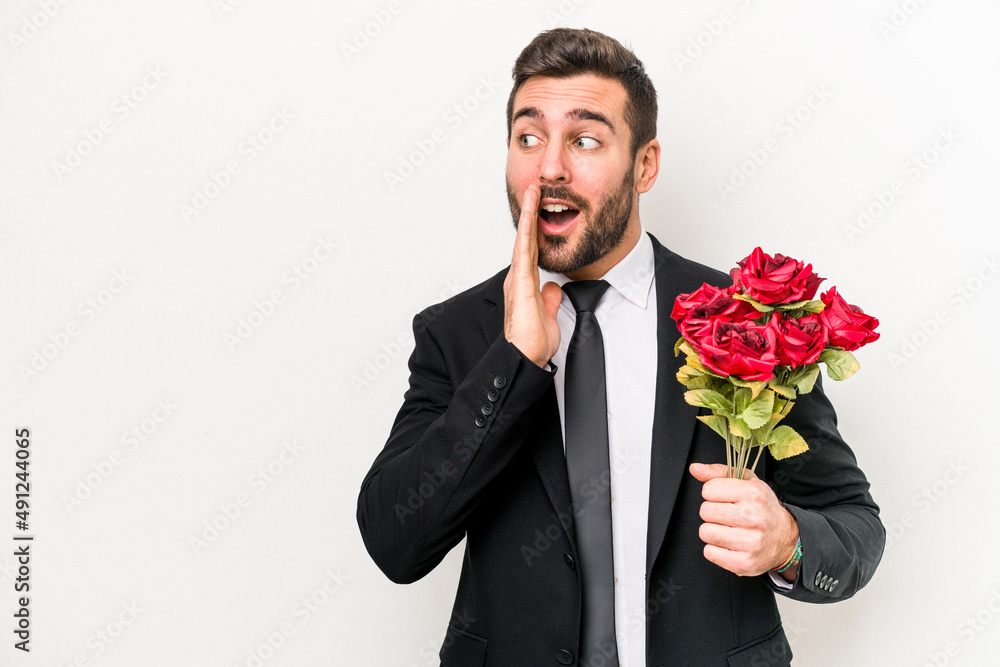 Young caucasian man holding a bouquet of flowers isolated on white background is saying a secret hot braking news and looking aside Young caucasian man holding a bouquet of flowers isolated on white background is saying a secret hot braking news and looking aside