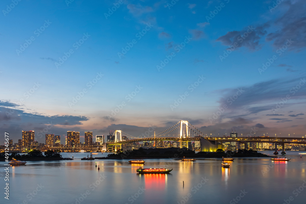 Japan, Kanto Region, Tokyo, Long exposure of Tokyo Bay and Rainbow Bridge at dusk Japan, Kanto Region, Tokyo, Long exposure of Tokyo Bay and Rainbow Bridge at dusk