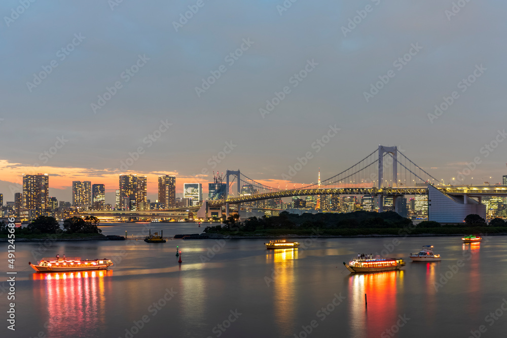 Japan, Kanto Region, Tokyo, Long exposure of Tokyo Bay and Rainbow Bridge at dusk Japan, Kanto Region, Tokyo, Long exposure of Tokyo Bay and Rainbow Bridge at dusk