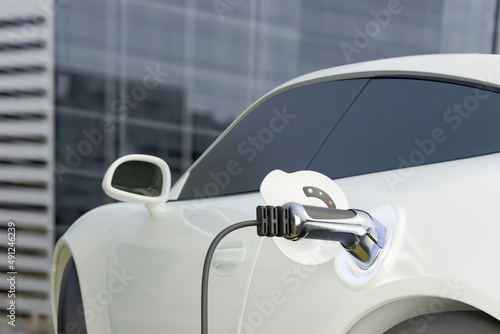 Hybrid car charging with electric plug photo