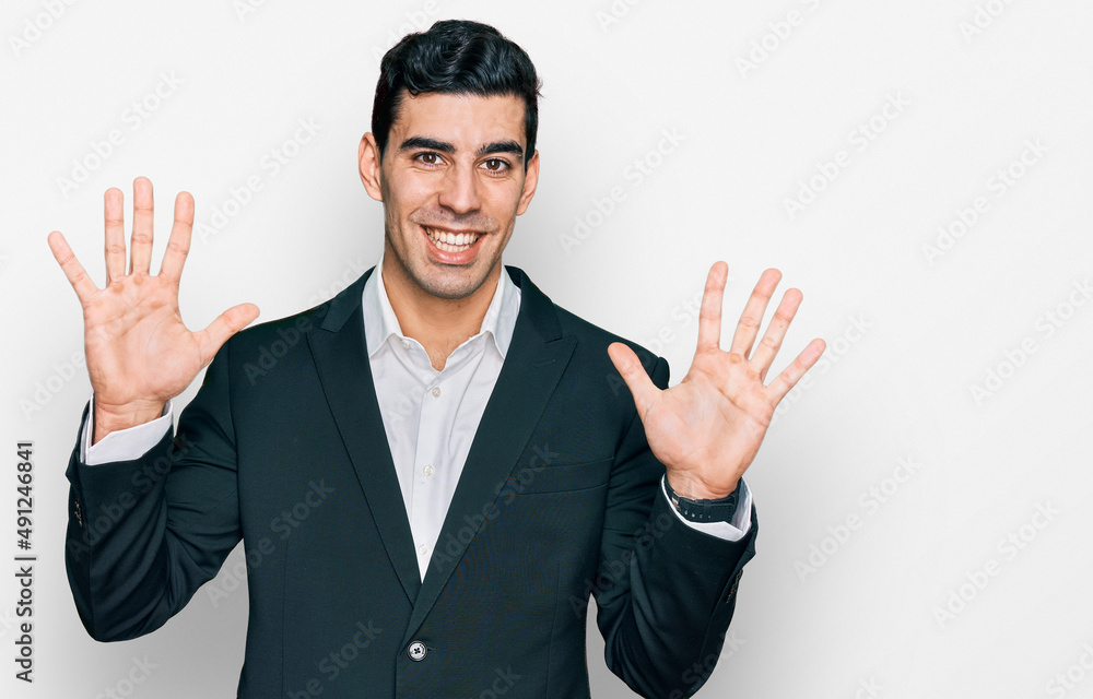 Handsome hispanic man wearing business clothes showing and pointing up with fingers number ten while smiling confident and happy. Handsome hispanic man wearing business clothes showing and pointing up with fingers number ten while smiling confident and happy.