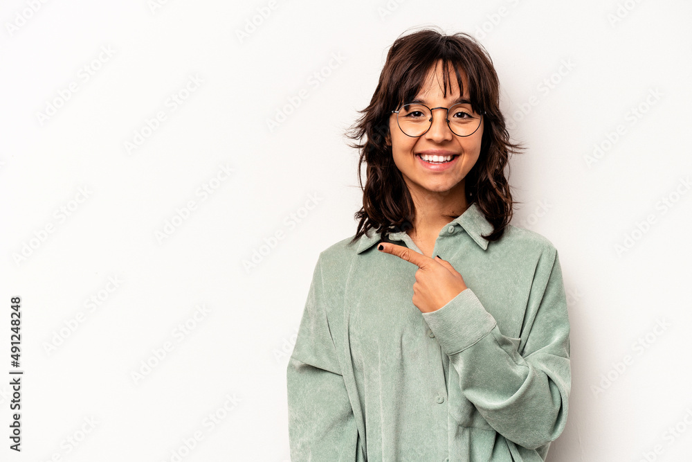 Young hispanic woman isolated on white background smiling and pointing aside, showing something at blank space. Young hispanic woman isolated on white background smiling and pointing aside, showing something at blank space.
