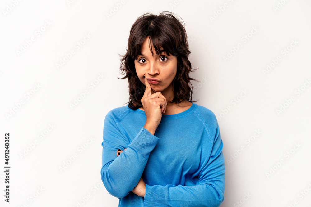 Young hispanic woman isolated on white background unhappy looking in camera with sarcastic expression. Young hispanic woman isolated on white background unhappy looking in camera with sarcastic expression.