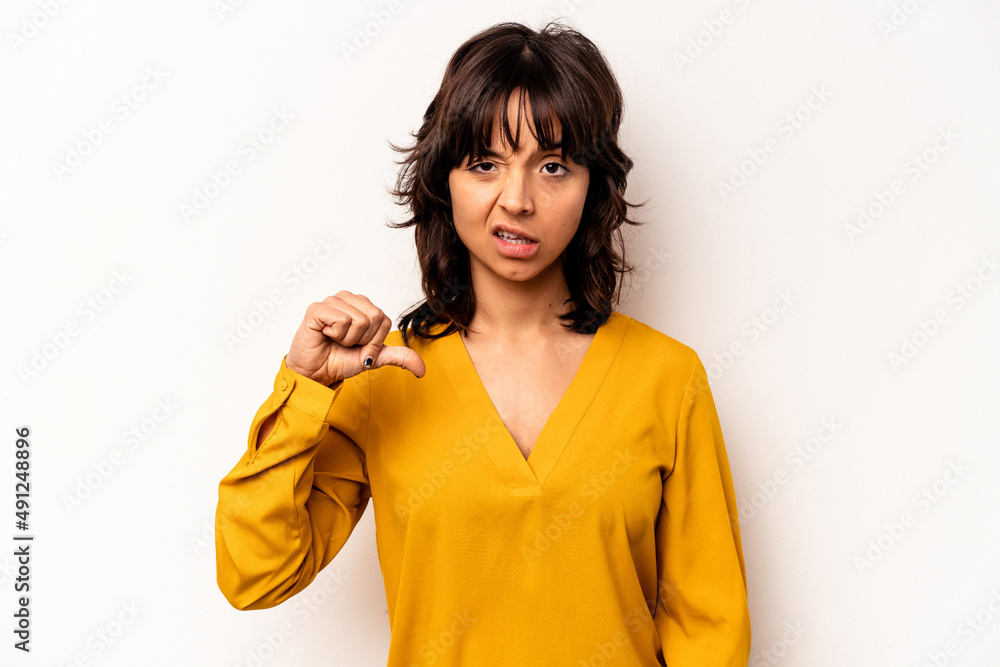 Young hispanic woman isolated on white background showing thumb down, disappointment concept.