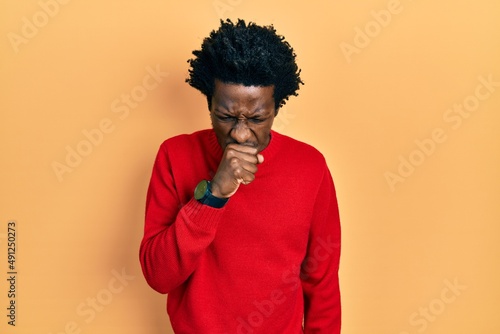 Young african american man wearing casual clothes feeling unwell and coughing as symptom for cold or bronchitis. health care concept. © Krakenimages.com