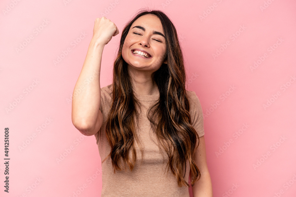 Young caucasian woman isolated on pink background celebrating a victory, passion and enthusiasm, happy expression. Young caucasian woman isolated on pink background celebrating a victory, passion and enthusiasm, happy expression.