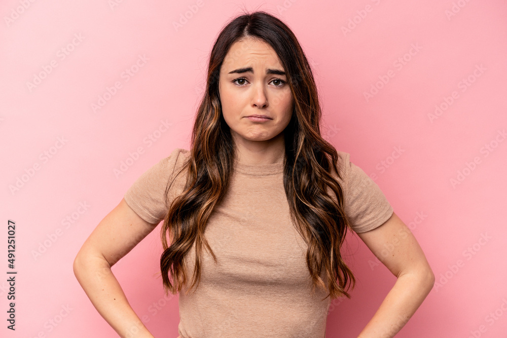 Young caucasian woman isolated on pink background sad, serious face, feeling miserable and displeased. Young caucasian woman isolated on pink background sad, serious face, feeling miserable and displeased.