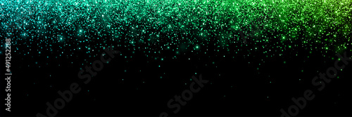 Wide blue green falling particles with glow lights on black background. Vector