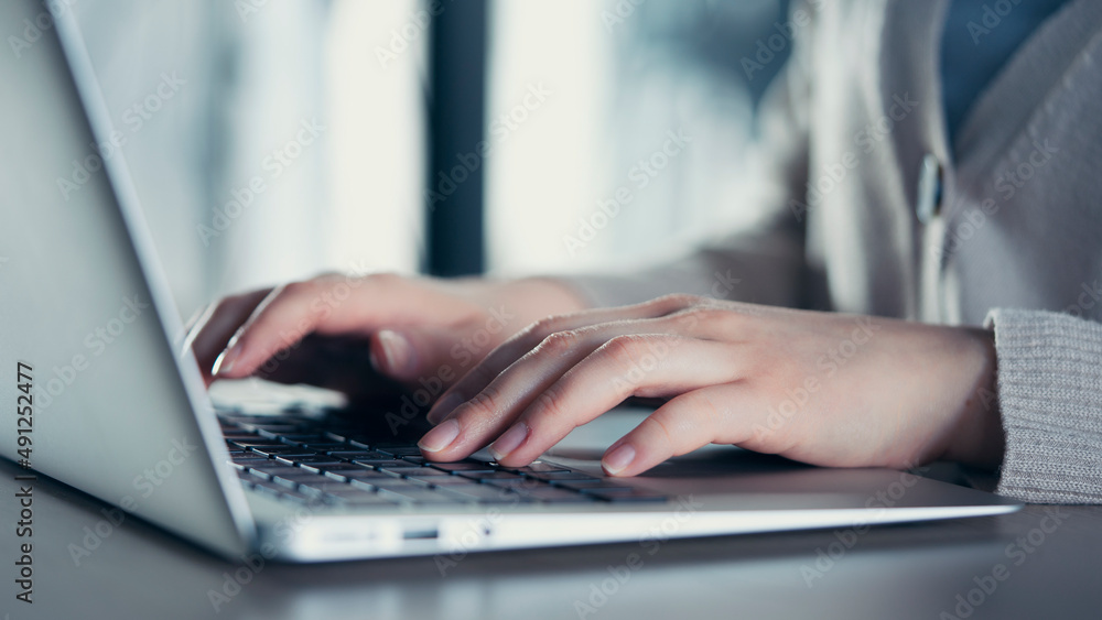 Woman hands on laptop keyboard Woman hands on laptop keyboard