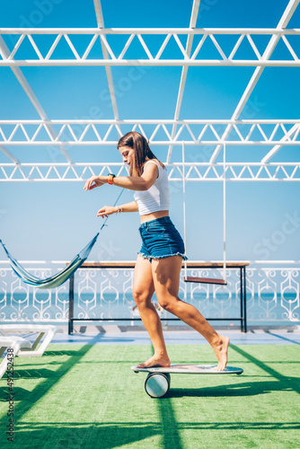 Woman balancing on board photo