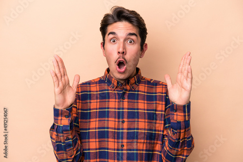 Young caucasian man isolated on beige background having an idea, inspiration concept.