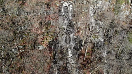 Close-up Aerial view and establishing shot of Ramhultafallet waterfall in forest flowing into lake Lygnern near Göteborg (Gothenburg), Sweden - Sätila-Marks, Västra Götaland Region - Bird's-eye view photo