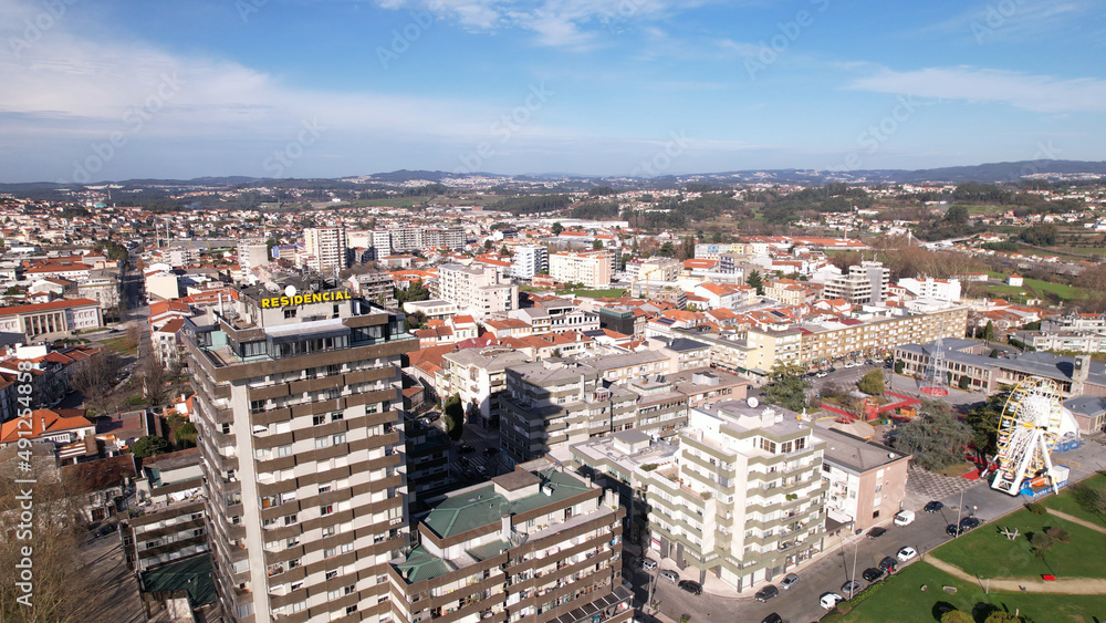 Santo Tirso, Portugal - January 1, 2022: DRONE AERIAL VIEW - Apartment buildings, 25th of April Square (Portuguese: Praca 25 de Abril) and Santo Tirso City Hall.
