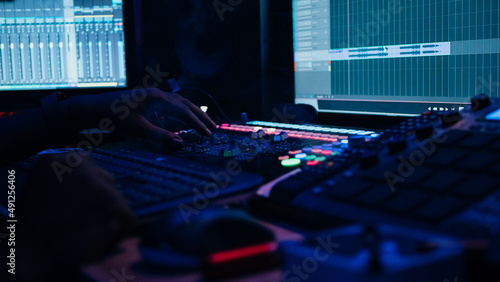 Music recording studio with blue lights
