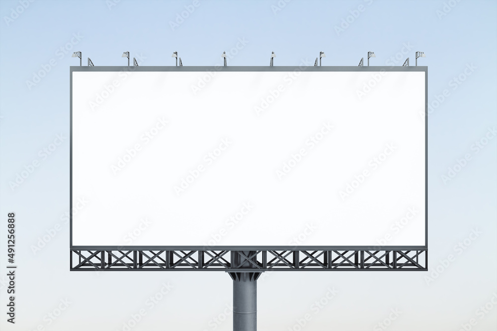 Blank white horizontal billboard on blue sky background at sunset, front view. Mock up, advertising concept Blank white horizontal billboard on blue sky background at sunset, front view. Mock up, advertising concept