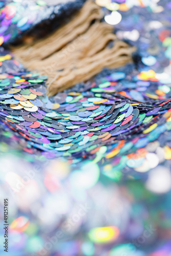 Closeup shot of a shiny multicolored sequin fabric. © blackday
