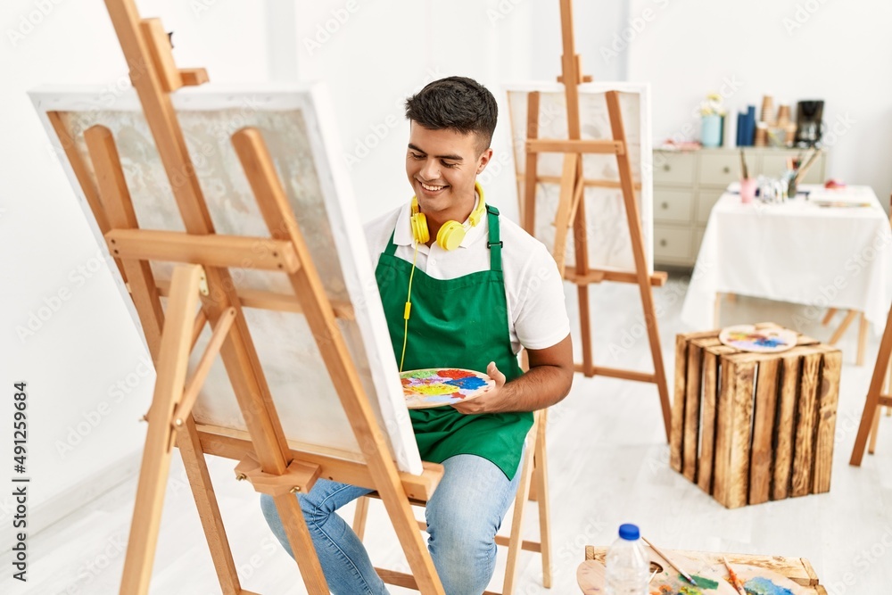 Young hispanic man smiling confident drawing at art studio Young hispanic man smiling confident drawing at art studio