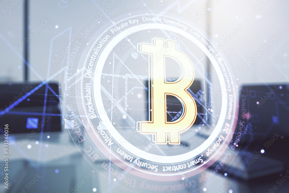 Double exposure of creative Bitcoin symbol hologram and modern desk with computer on background. Mining and blockchain concept Double exposure of creative Bitcoin symbol hologram and modern desk with computer on background. Mining and blockchain concept