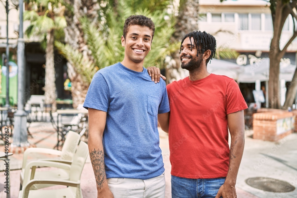 Two african american man smiling happy standing at the city. Two african american man smiling happy standing at the city.
